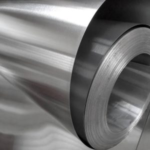 roll of aluminum metal in industrial space. thin and shiny metal